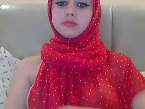 Arab hijab Barely legal teen In Red Arabian hijab Displays Her Nice looking Breasts On Webcam