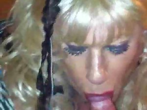Blondie transvestite caresses prick
