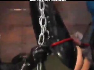 Latex couple Strapon screwing in sex swing BDSM