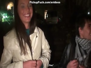 Nice looking lassie licks two penises for money right in the street